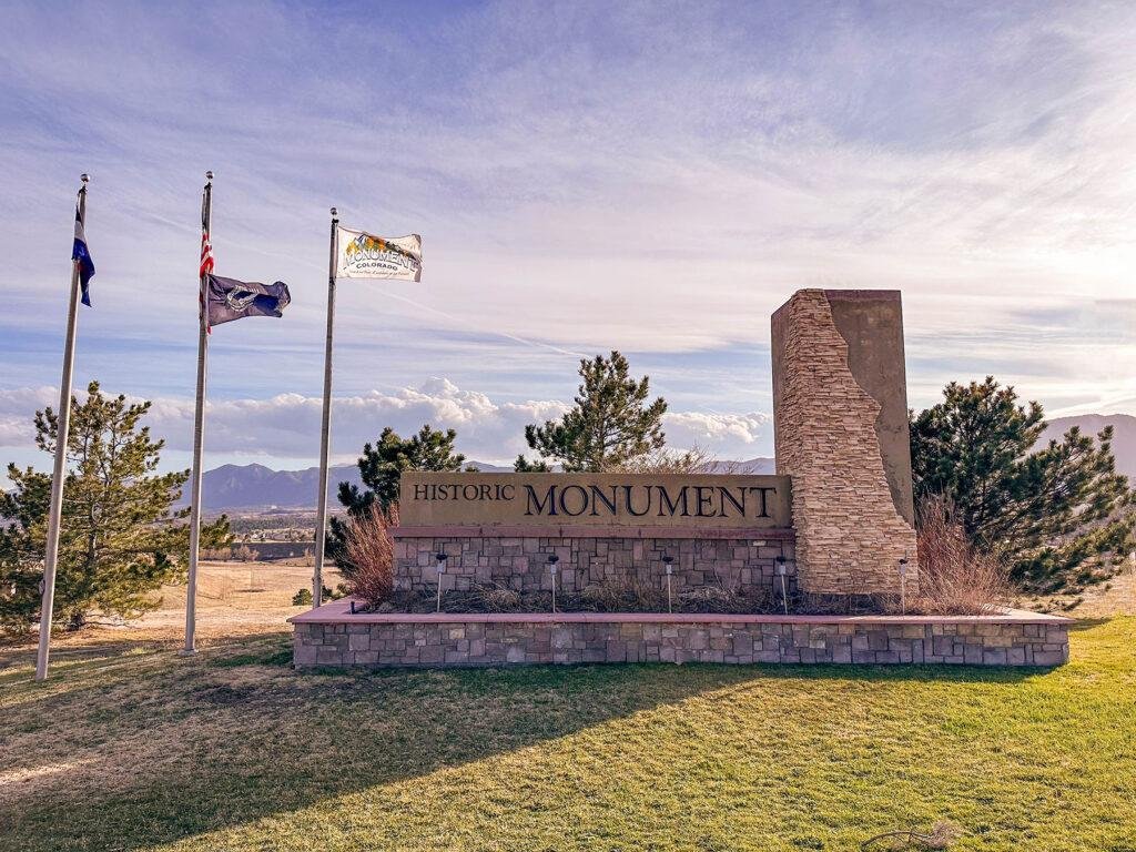 Historic Monument gateway sign and stone monument