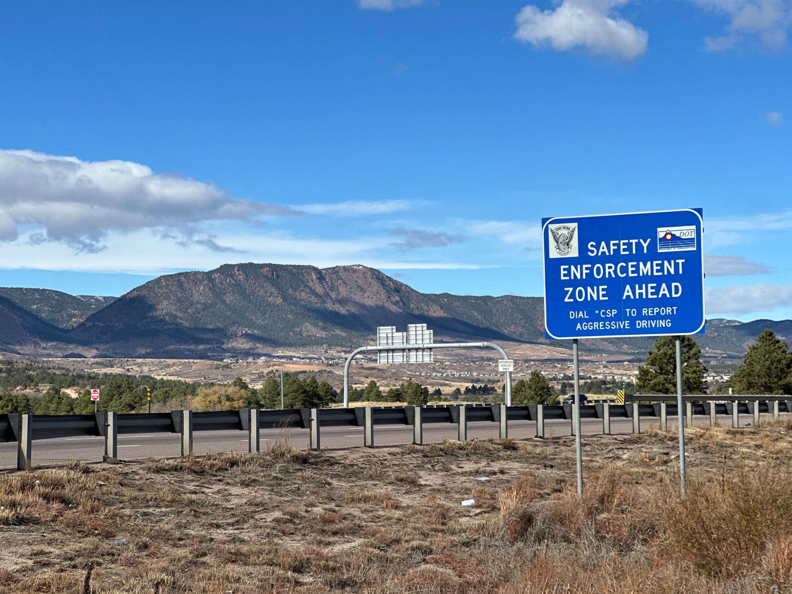 Colorado State Patrol and CDOT safety enforcement zone sign beside I-25 near Monument.