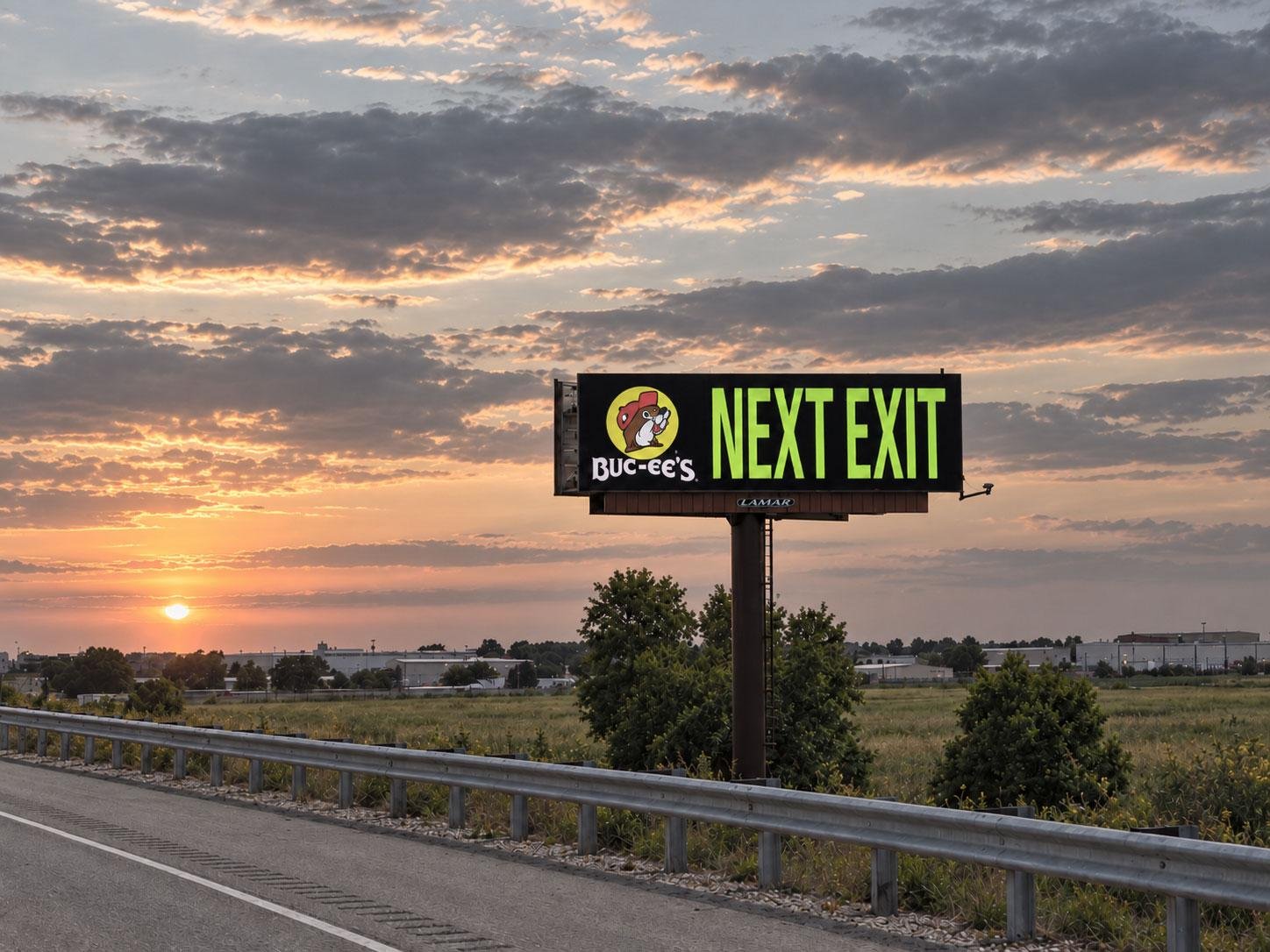 Buc-ee's highway exit sign at sunset in Colorado