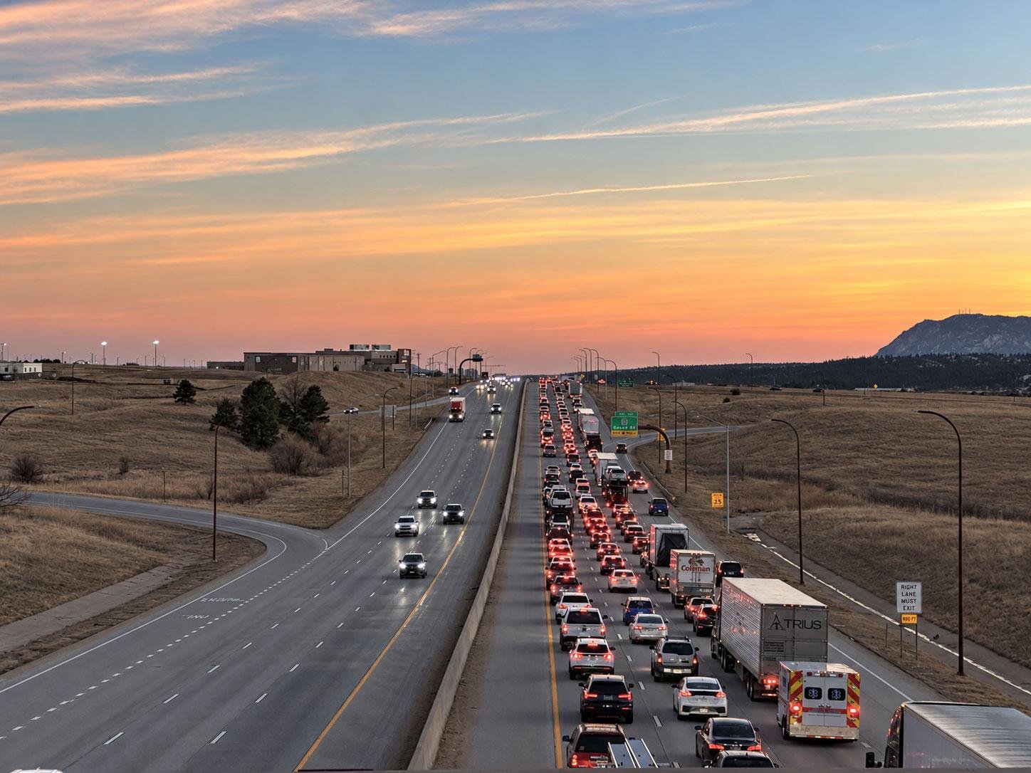 Interstate highway traffic at dusk illustrating road access and development considerations